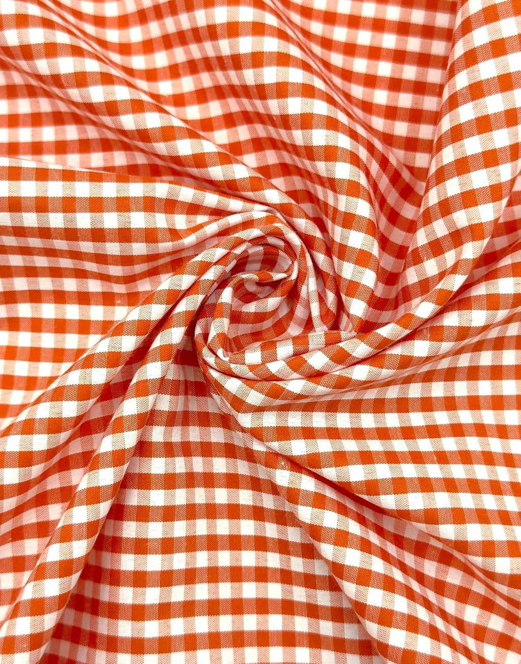 Orange poly-cotton gingham fabric with 1/8-inch checks